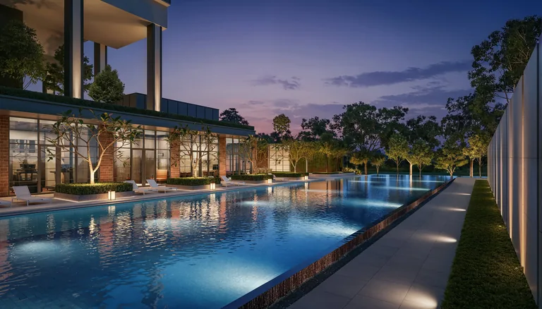 Hudson Place Residences, artist&rsquo;s impression: the 50-metre pool at dusk, lit along its length beside the glass of the clubhouse and a planted wall