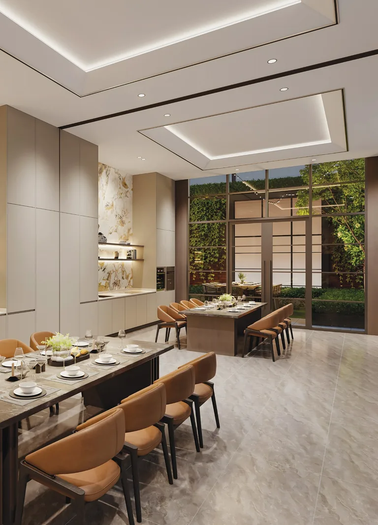 Hudson Place Residences, artist’s impression: a function room of the clubhouse, a long dining table set for a dinner beside a kitchen counter and a glass wall to the garden